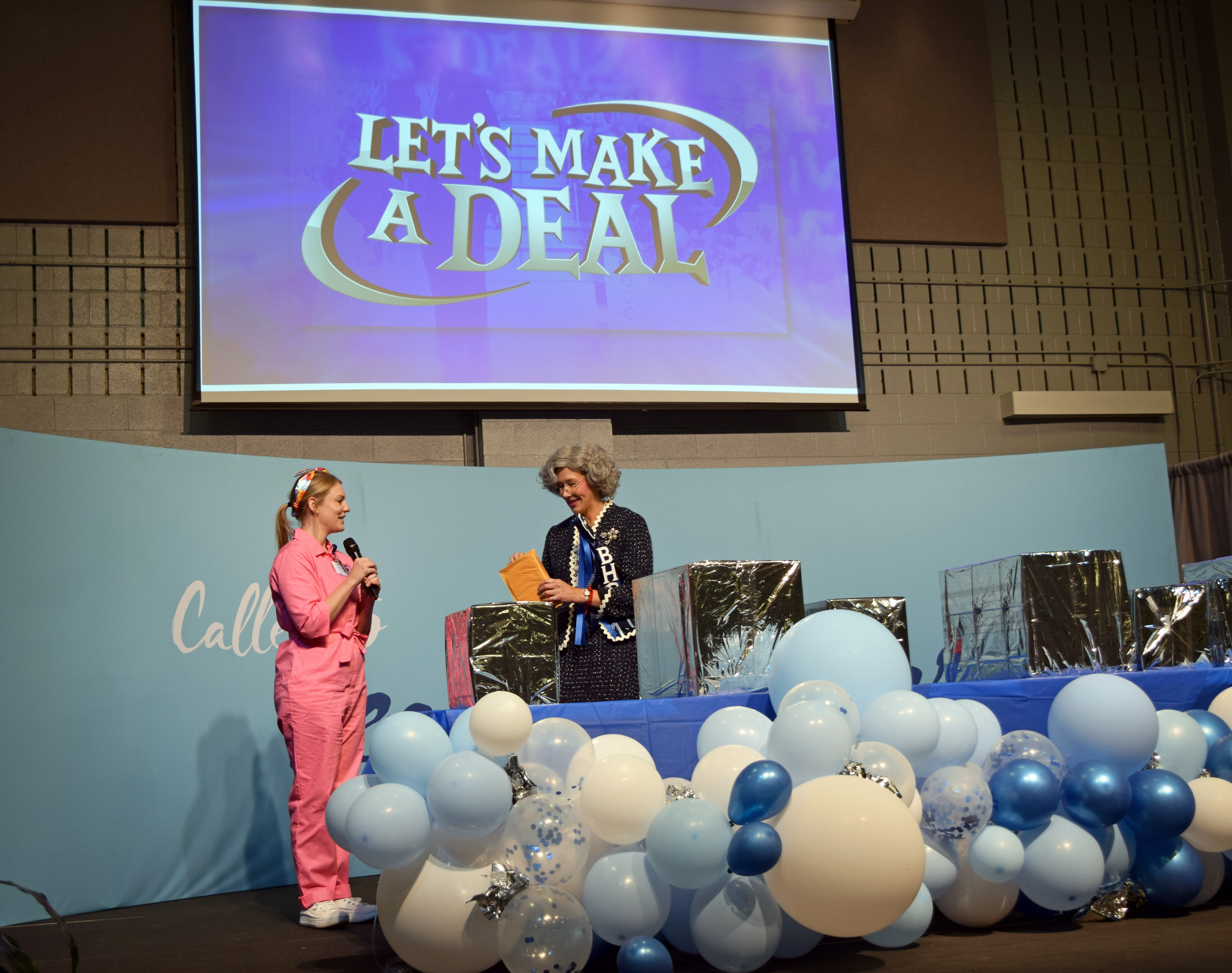 HR Director with Admissions Director playing lets make a deal