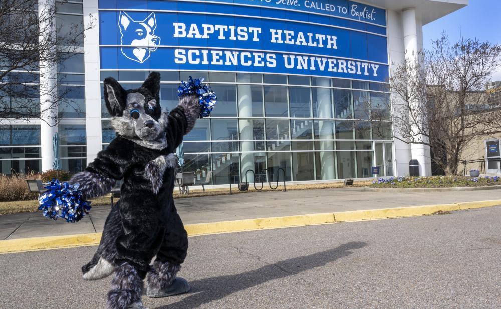 Hartley in front of the Collaboration Building