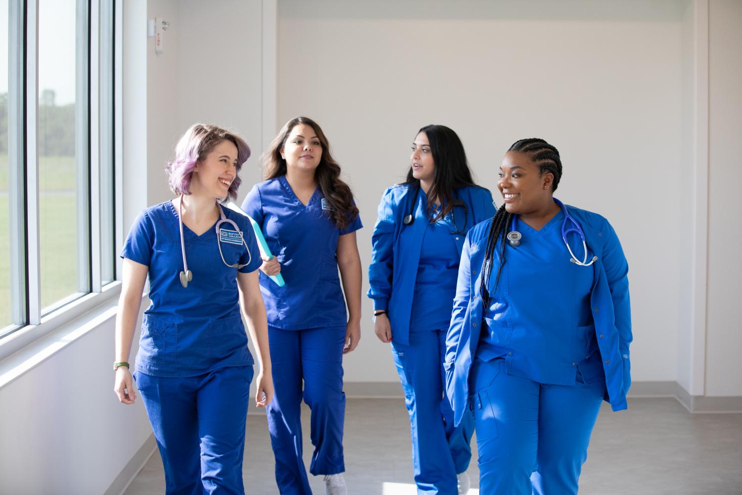 Baptist students walking in nursing hallway