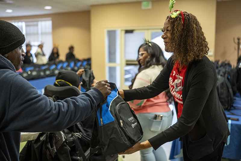 passing out bookbags 