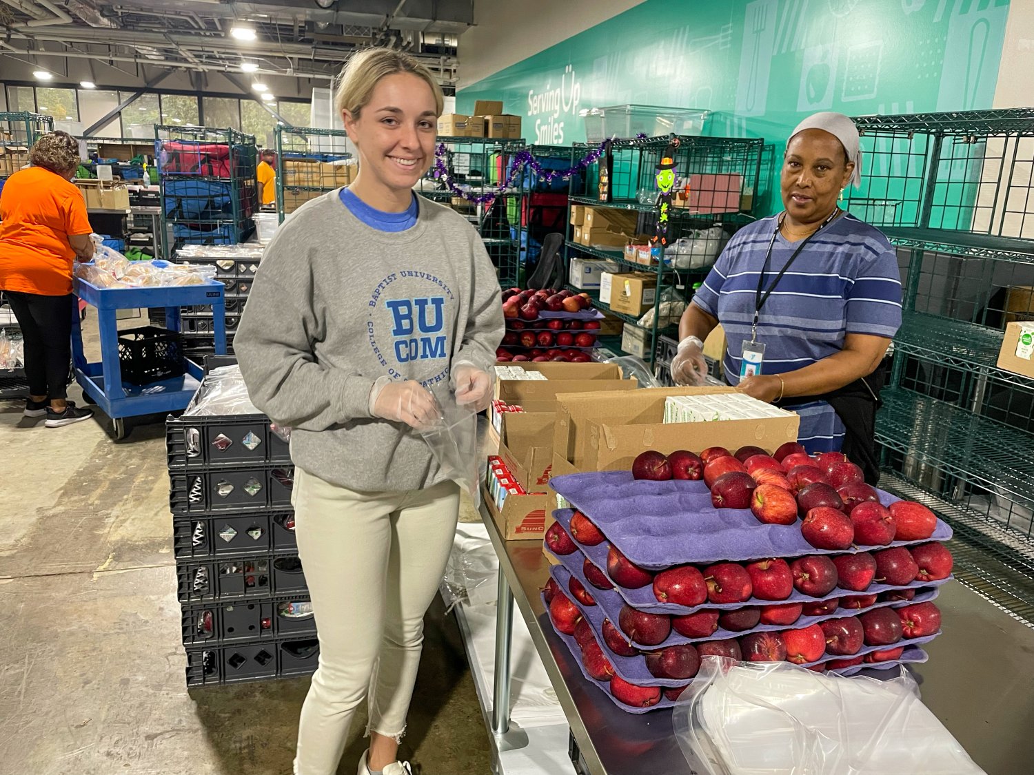 two students packaging items 