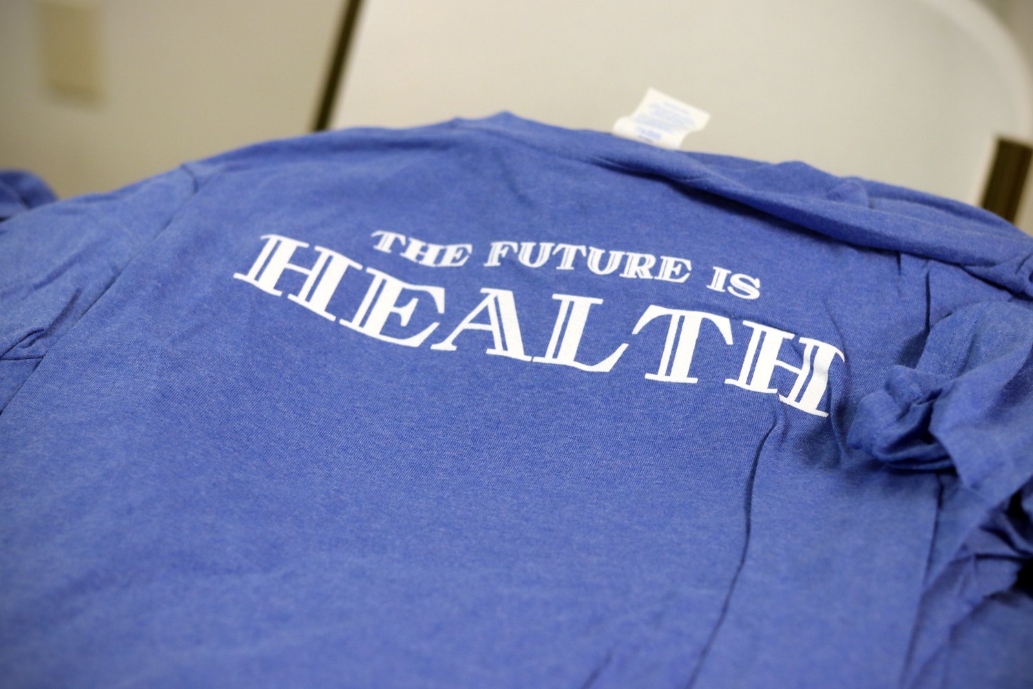 the future is health on a blue shirt