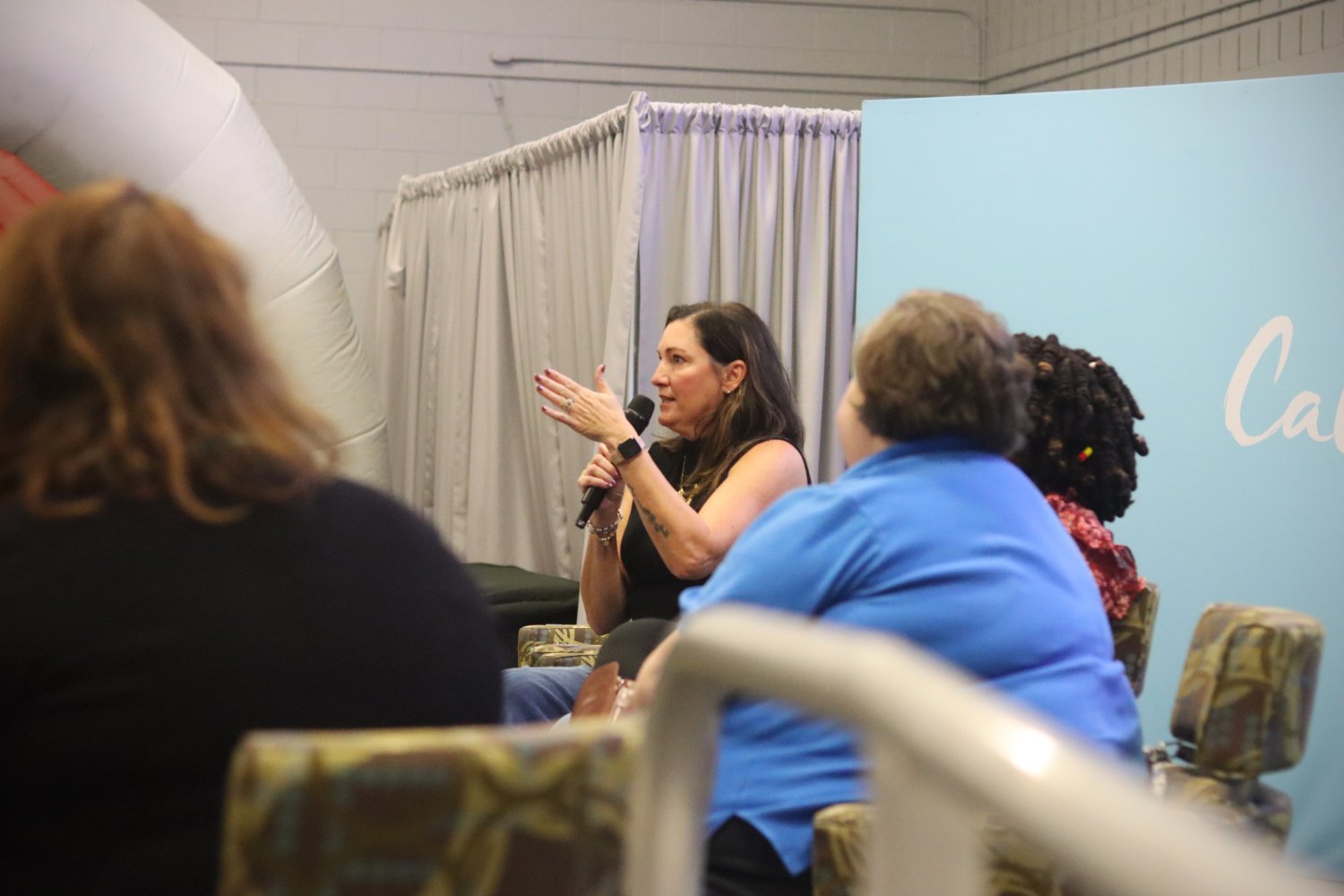 The expert panelist speaking using a microphone